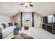 Cozy living room featuring plush carpeting, vaulted ceilings, and a wall of natural light at 8156 E 35Th Ave, Denver, CO 80238