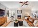 Cozy living room featuring a fireplace and comfortable seating, creating an inviting atmosphere at 8156 E 35Th Ave, Denver, CO 80238
