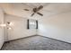 Bedroom featuring carpeted floors, natural light from the window, and a ceiling fan at 1612 Cottonwood Dr # 2W, Louisville, CO 80027