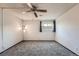 Bedroom featuring carpeted floors, natural light from the window, and a ceiling fan at 1612 Cottonwood Dr # 2W, Louisville, CO 80027