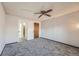 Bedroom with carpeted floors, natural light, wood closet doors and a ceiling fan at 1612 Cottonwood Dr # 2W, Louisville, CO 80027