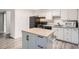 Bright kitchen with an island and white cabinets at 1612 Cottonwood Dr # 2W, Louisville, CO 80027