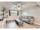 Living room with gray couch and wood-look floors at 1612 Cottonwood Dr # 2W, Louisville, CO 80027