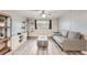 Living room with gray couch and wood-look floors at 1612 Cottonwood Dr # 2W, Louisville, CO 80027