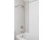 Modern bathroom featuring a soaking tub with stylish gray and white tile surround at 1457 Yates St, Denver, CO 80204