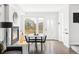 Bright dining room featuring a modern fireplace, stylish table set, and hardwood floors at 1457 Yates St, Denver, CO 80204
