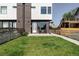 Charming home with a lush green front yard and modern architectural details at 1457 Yates St, Denver, CO 80204