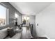 Hallway features a small desk next to the staircase and access to an outdoor deck at 1457 Yates St, Denver, CO 80204