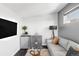 Inviting living space with wet bar, sleek furniture, and bright natural light at 1457 Yates St, Denver, CO 80204