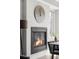 Cozy living room featuring a modern fireplace, stylish seating, and abundant natural light at 1457 Yates St, Denver, CO 80204