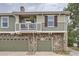 Exterior view of the house with two-car garage and balcony at 12832 Mayfair Way # F, Englewood, CO 80112