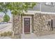 Front door entrance to townhome with stone accents at 12832 Mayfair Way # F, Englewood, CO 80112