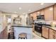 Modern kitchen with stainless steel appliances and an island at 12832 Mayfair Way # F, Englewood, CO 80112