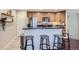 Modern kitchen with stainless steel appliances and an island at 12832 Mayfair Way # F, Englewood, CO 80112