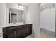 Elegant bathroom with double sink vanity, dark wood cabinets and modern finishes at 9756 Mount Kataka Pt, Littleton, CO 80125
