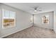 Bright bedroom with three windows and a ceiling fan, offering comfort and natural light at 9756 Mount Kataka Pt, Littleton, CO 80125