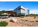 Striking building exterior with modern architectural design, accented by surrounding landscaping, and walking paths at 9756 Mount Kataka Pt, Littleton, CO 80125