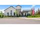Attractive leasing center/clubhouse with modern architectural details and well-maintained landscaping at 9756 Mount Kataka Pt, Littleton, CO 80125
