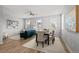 Open concept space combining living and dining areas with lots of windows at 9756 Mount Kataka Pt, Littleton, CO 80125