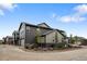 New townhouse exterior with solar panels, a stone foundation and professionally landscaped front yard at 9756 Mount Kataka Pt, Littleton, CO 80125