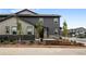 Well-maintained two-story home with neutral color scheme and attractive landscaping at 9756 Mount Kataka Pt, Littleton, CO 80125