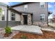 Inviting front entrance with stone accents and well-manicured landscaping at 9756 Mount Kataka Pt, Littleton, CO 80125