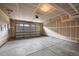 Spacious unfinished two car garage with concrete floor and drywalled walls at 9756 Mount Kataka Pt, Littleton, CO 80125