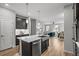 Kitchen featuring stainless steel appliances, an island and an open concept floor plan at 9756 Mount Kataka Pt, Littleton, CO 80125