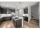 Kitchen featuring stainless steel appliances, granite countertops, dark cabinets and wood flooring at 9756 Mount Kataka Pt, Littleton, CO 80125