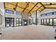 Bright lobby area with high ceilings, stylish chandeliers, stone fireplace, and large windows offering great views at 9756 Mount Kataka Pt, Littleton, CO 80125