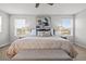 Spacious main bedroom featuring two windows, neutral tones, and modern decor at 9756 Mount Kataka Pt, Littleton, CO 80125