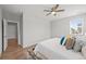 Bright main bedroom with an ensuite bathroom and a ceiling fan at 9756 Mount Kataka Pt, Littleton, CO 80125