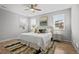Bright main bedroom with many windows and decorative pillows at 9756 Mount Kataka Pt, Littleton, CO 80125