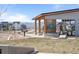 Community pavilion featuring picnic tables, a barbecue, and views of the surrounding homes and distant mountains at 9756 Mount Kataka Pt, Littleton, CO 80125