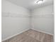 Spacious walk-in closet with wall-mounted shelving, offering ample storage at 9756 Mount Kataka Pt, Littleton, CO 80125