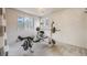 Spacious exercise room featuring weightlifting equipment and ample natural light at 11531 S Deer Creek Rd, Littleton, CO 80127
