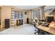 Inviting home office with bright windows and comfortable furnishings, perfect for work or study at 11531 S Deer Creek Rd, Littleton, CO 80127