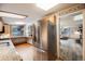 A spacious kitchen with stainless steel refrigerator and an open layout provides convenience and style at 11531 S Deer Creek Rd, Littleton, CO 80127