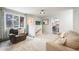 Cozy living room showcasing comfortable seating, carpet flooring, and a staircase leading to the next level at 11531 S Deer Creek Rd, Littleton, CO 80127