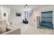 Bright living room featuring comfortable seating, carpet flooring, and access to other rooms at 11531 S Deer Creek Rd, Littleton, CO 80127