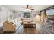 Cozy living room features a stone fireplace, plush seating, and natural light for a relaxing atmosphere at 11531 S Deer Creek Rd, Littleton, CO 80127