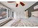 Spacious main bedroom with deck access, natural light, and neutral color scheme at 11531 S Deer Creek Rd, Littleton, CO 80127