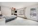 Serene main bedroom with deck access, ceiling fan, and ample natural light at 11531 S Deer Creek Rd, Littleton, CO 80127