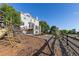 Beautiful backyard featuring a playset, a deck, and a well-maintained lawn at 7630 Chickaree Pl, Littleton, CO 80125