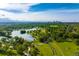 Scenic aerial view of a park with a lake and the Denver skyline in the distance on a sunny day at 535 Josephine St, Denver, CO 80206