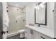 Modern bathroom with shower, vanity and toilet. Contemporary design featuring mixed tile and white vanity at 535 Josephine St, Denver, CO 80206