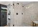 Modern bathroom with a glass enclosed shower featuring sleek tile work and black hardware at 535 Josephine St, Denver, CO 80206