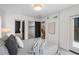 Bright bedroom with closet and bathroom access and stairs to the second floor at 535 Josephine St, Denver, CO 80206