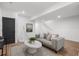 Cozy living room with a plush gray sofa, stylish coffee table, and a minimalist design at 535 Josephine St, Denver, CO 80206