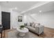Cozy living room with comfortable seating, modern decor, and access to stairs at 535 Josephine St, Denver, CO 80206